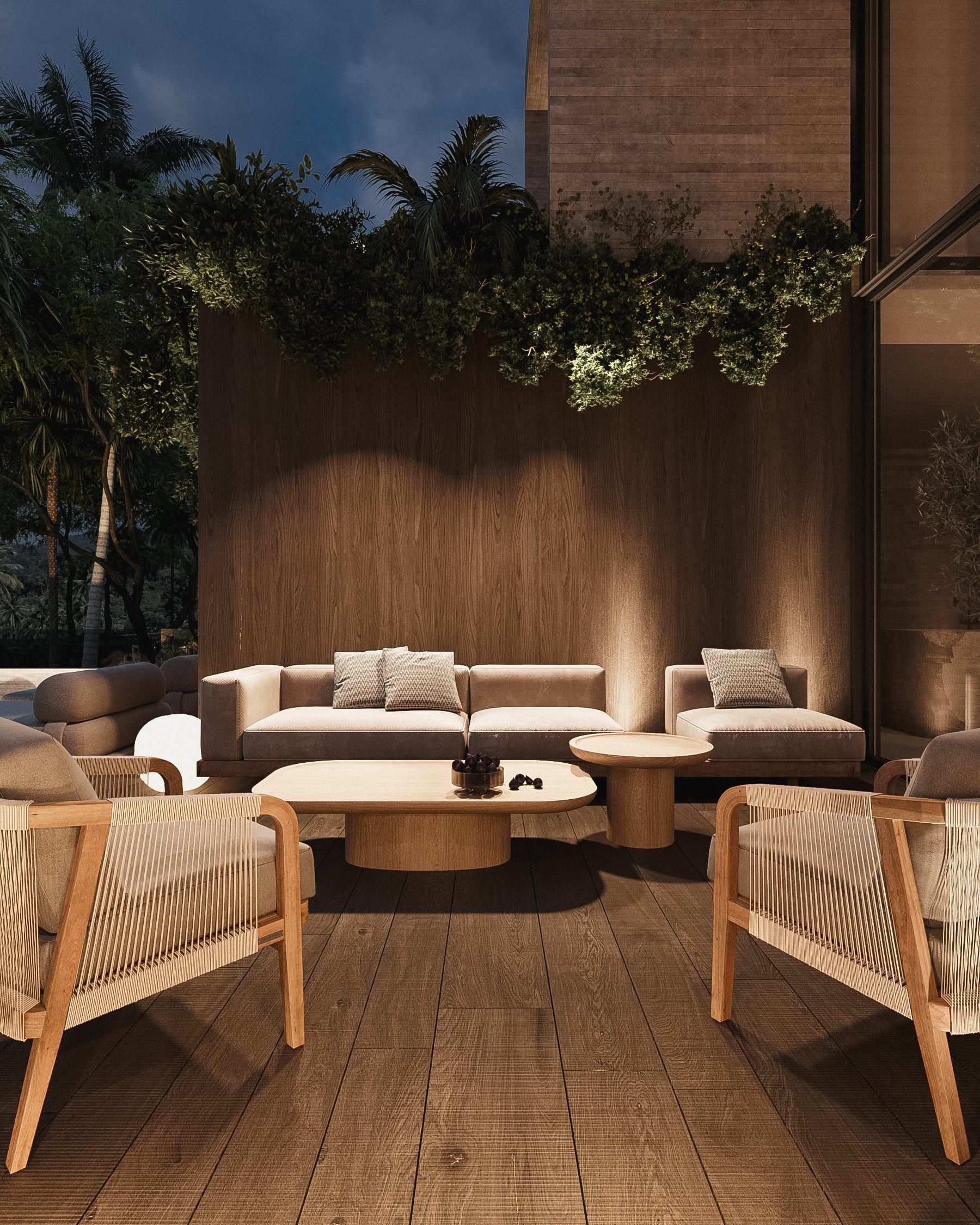 Evening terrace with sofas and planted wall backdrop