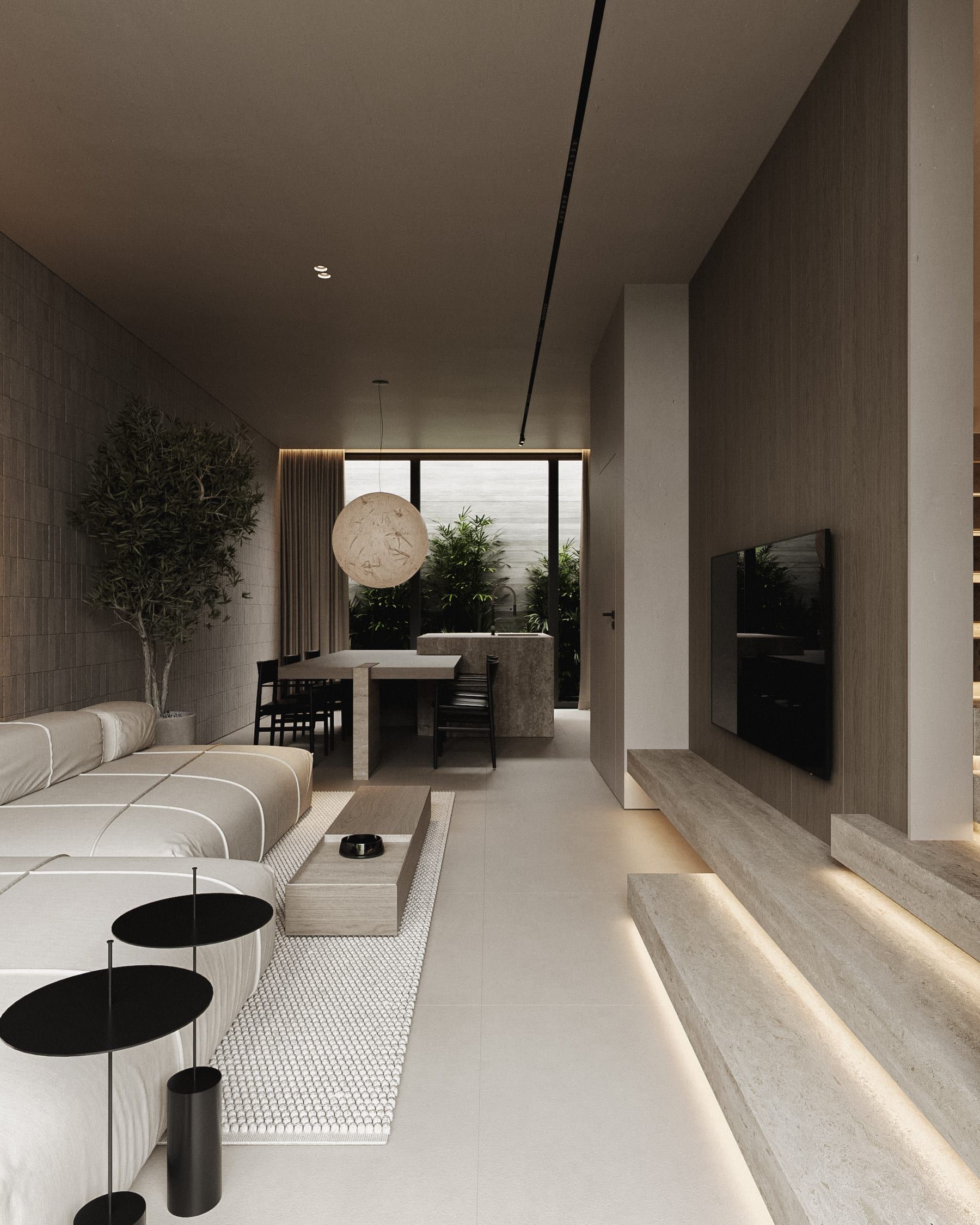 Open-plan living space, wooden finishes, pendant light, green plants
