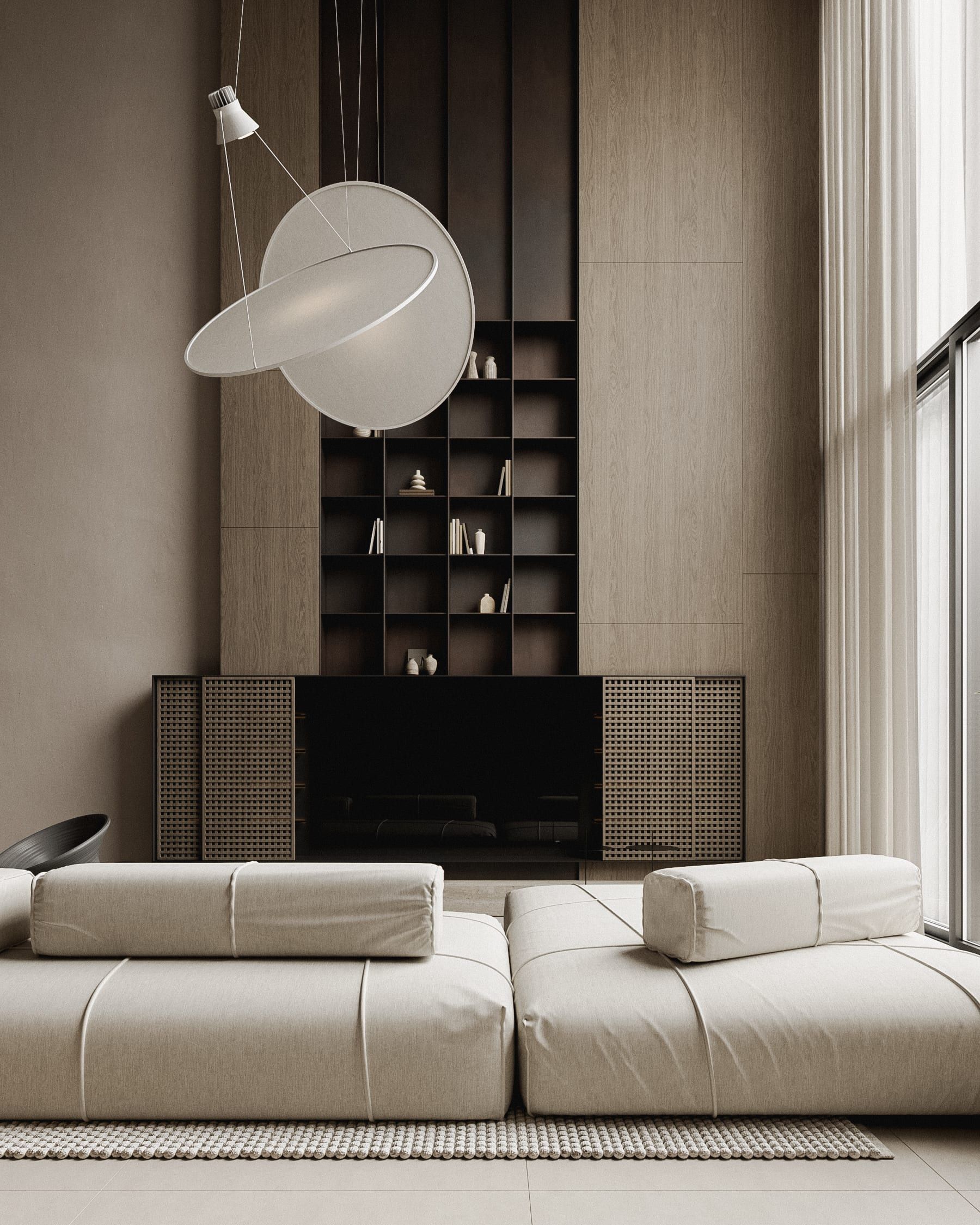 Living room with hanging chair, black storage unit and sectional sofa