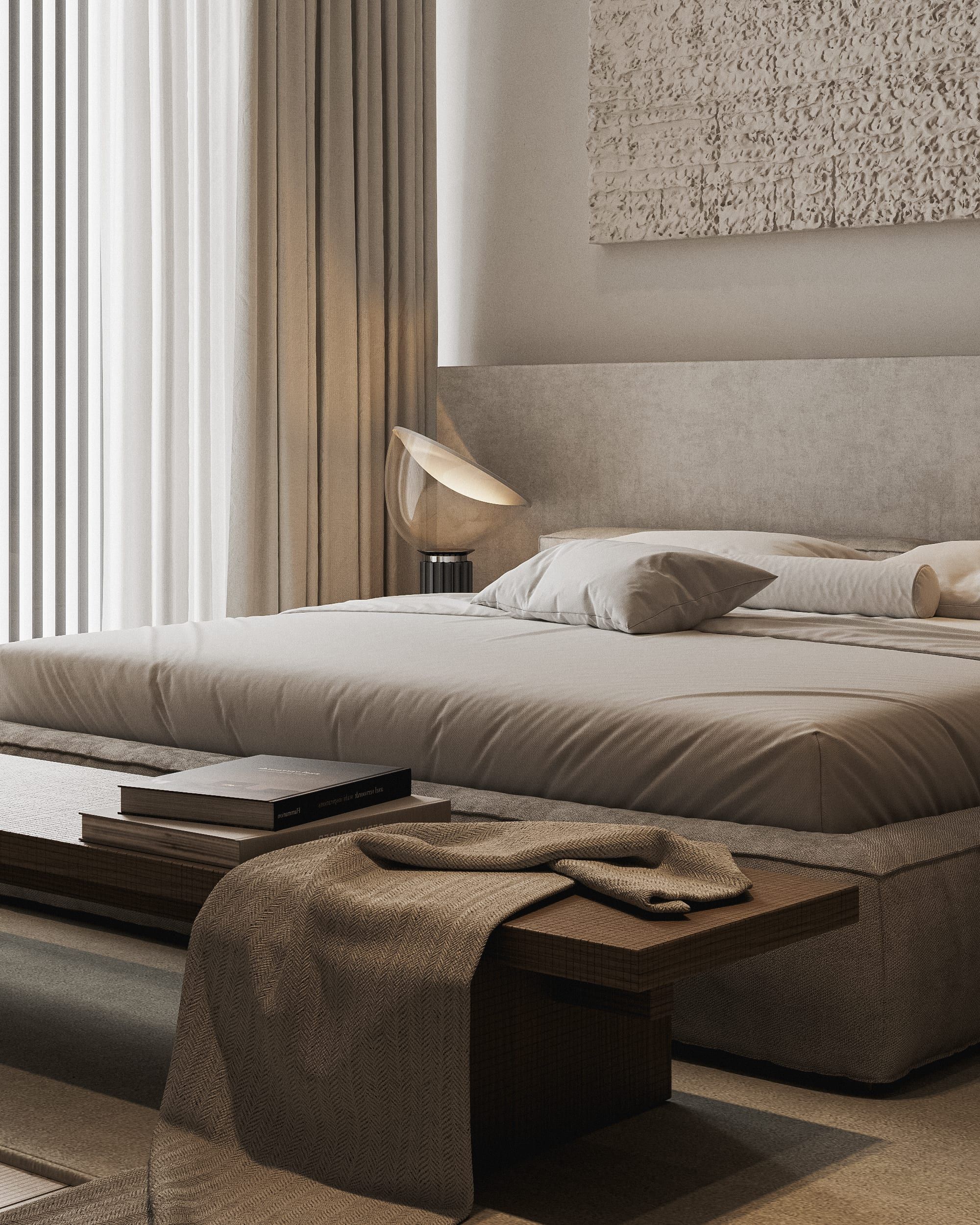 Bed by window with fabric wall panel and soft furnishings