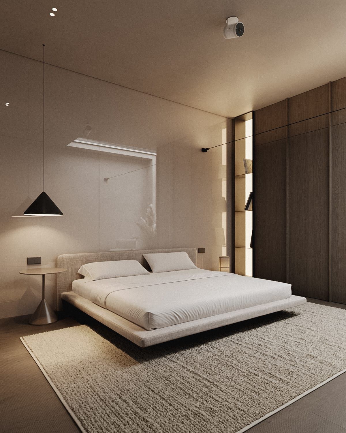 Bedroom with raised bed platform, pendant light, integrated wall lighting