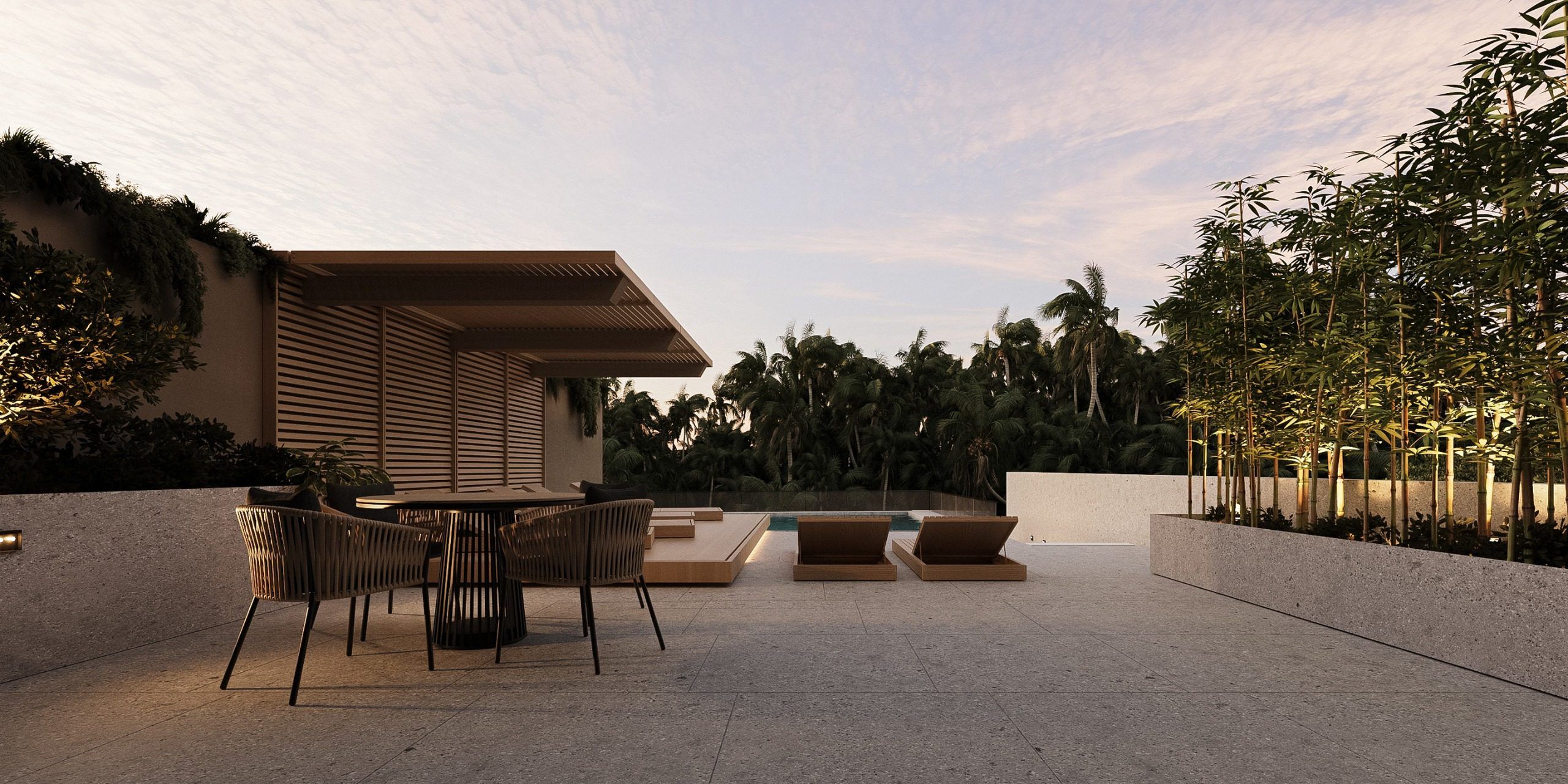 Outdoor leisure area with furniture, landscaping and sunset sky