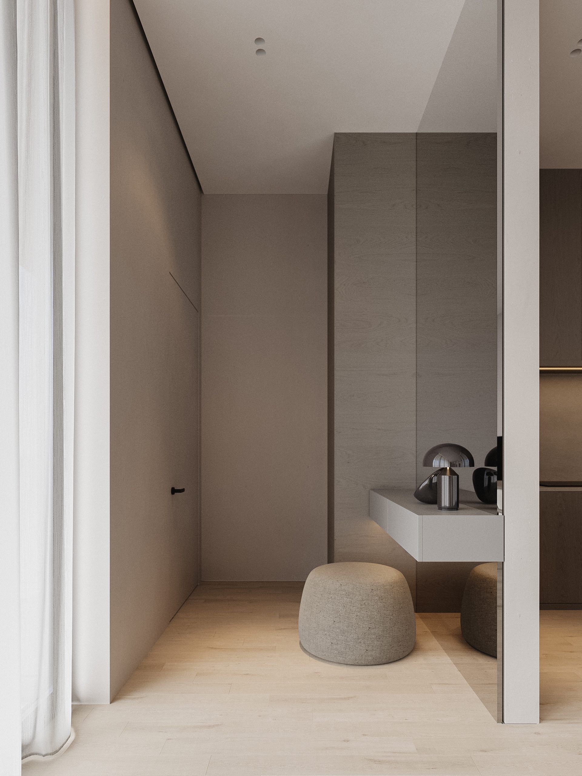 Passage area with mirror and upholstered pouffe