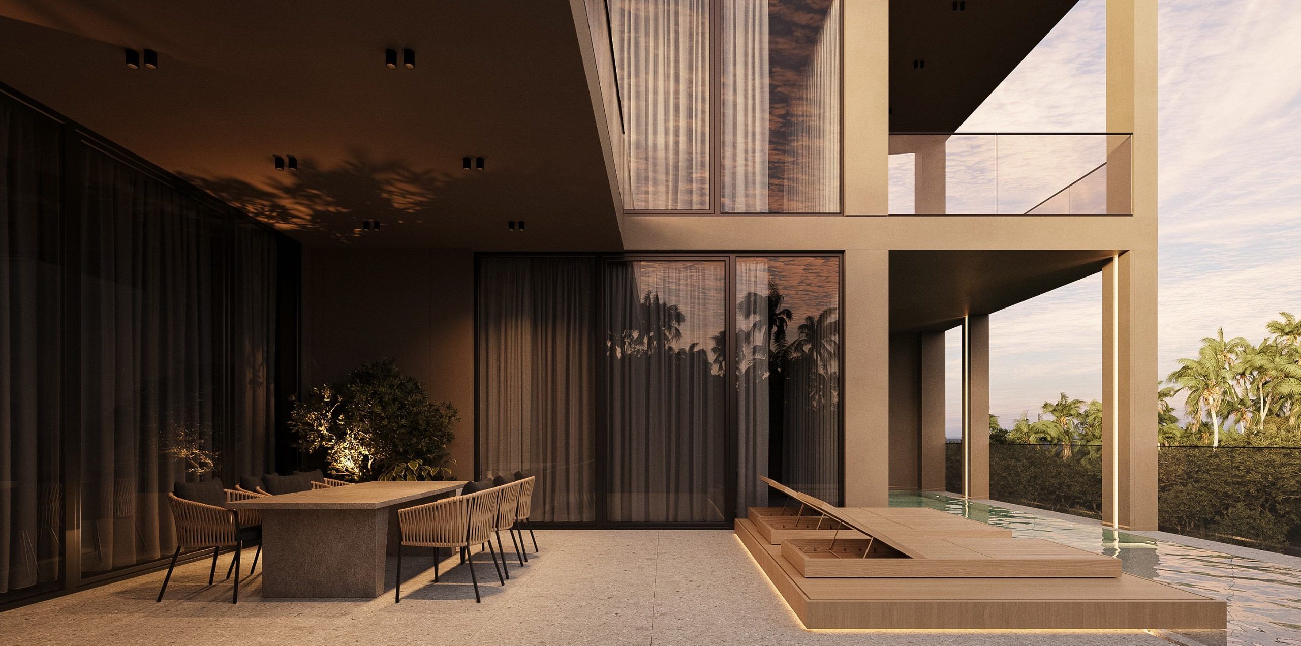 Dining area with table and glazed wall opening to terrace