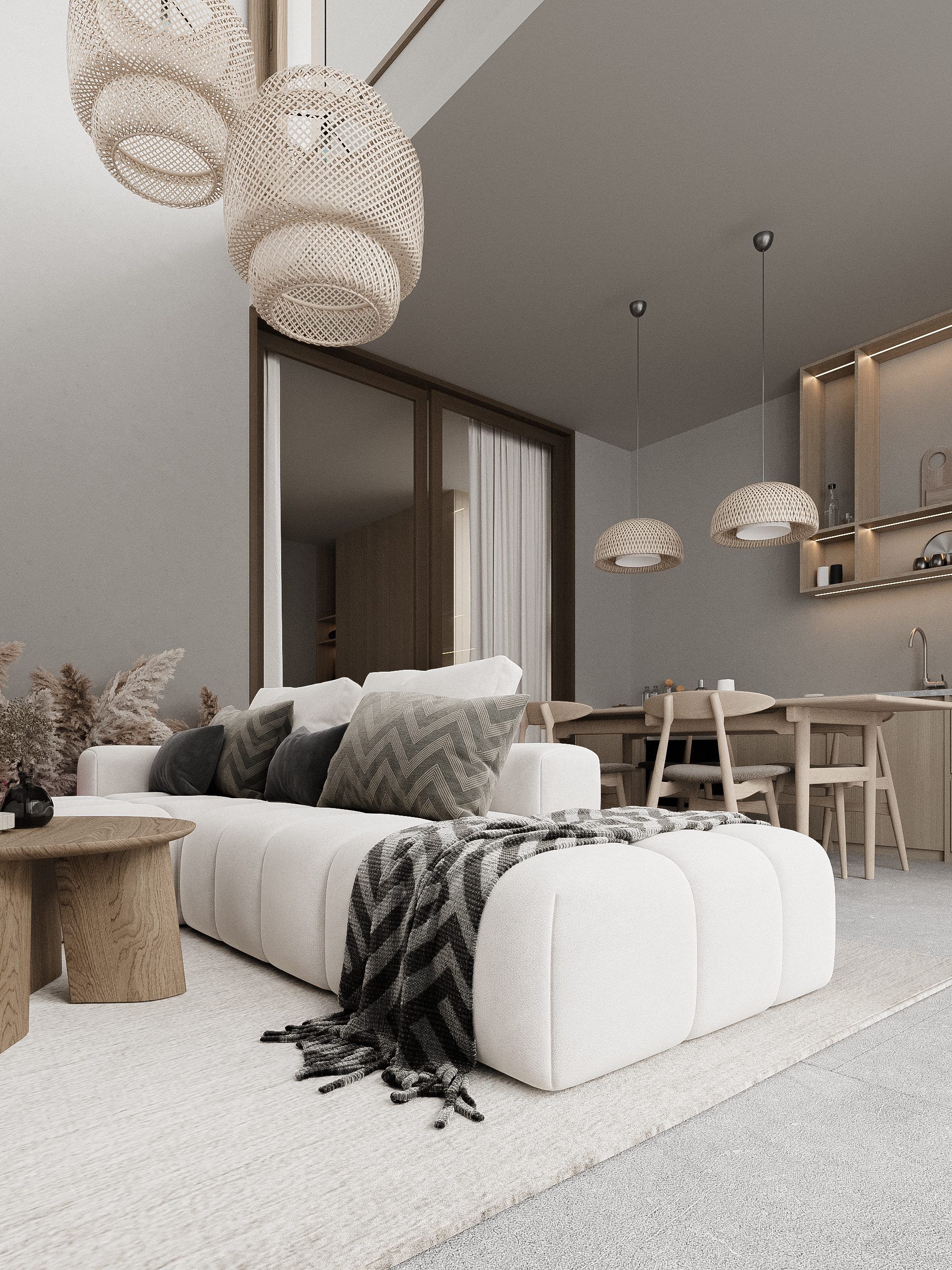 Bedroom-lounge with soft seating, woven pendant lights and greenery