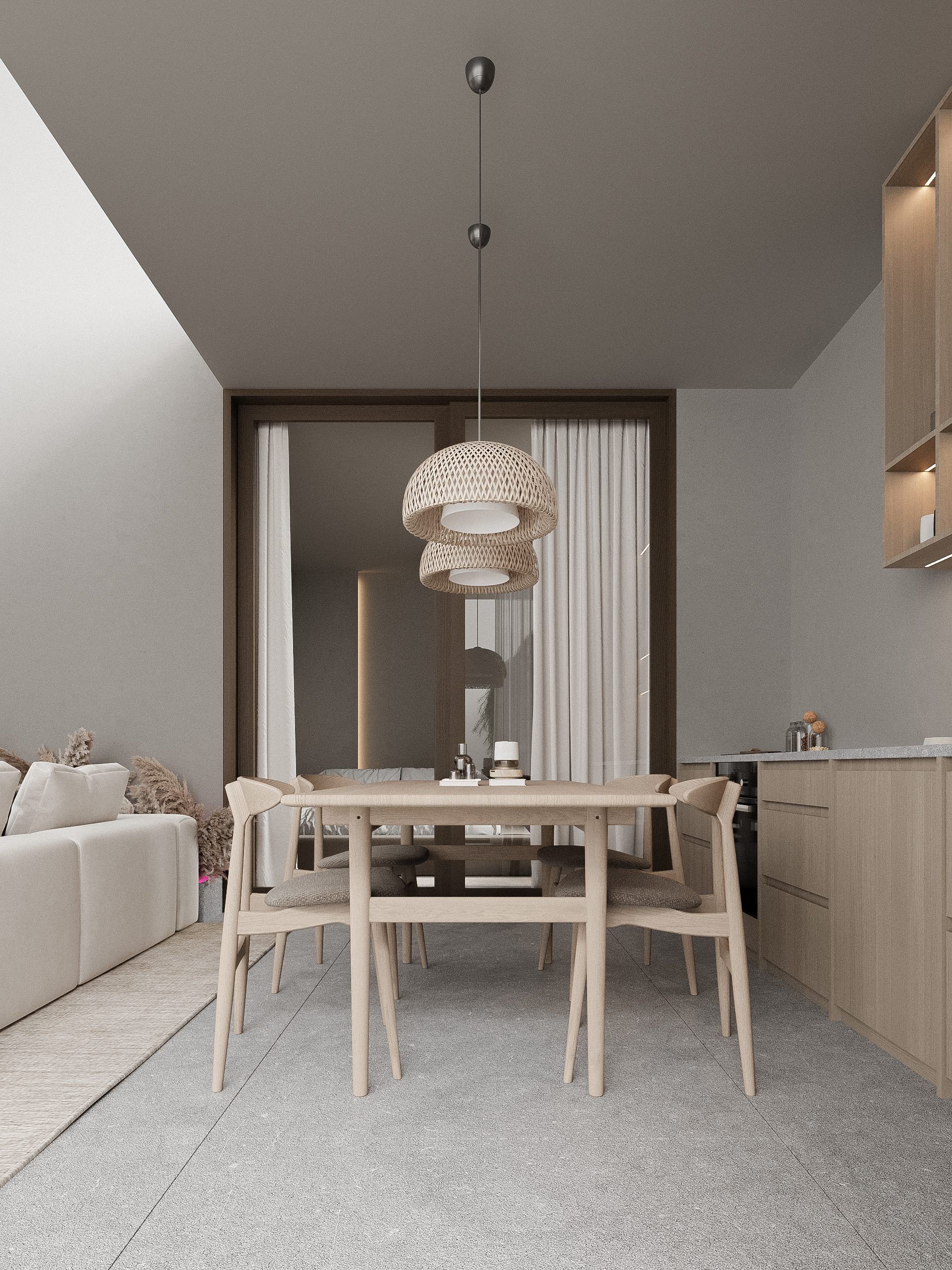 Space with wooden table, soft seating and pendant light fixture