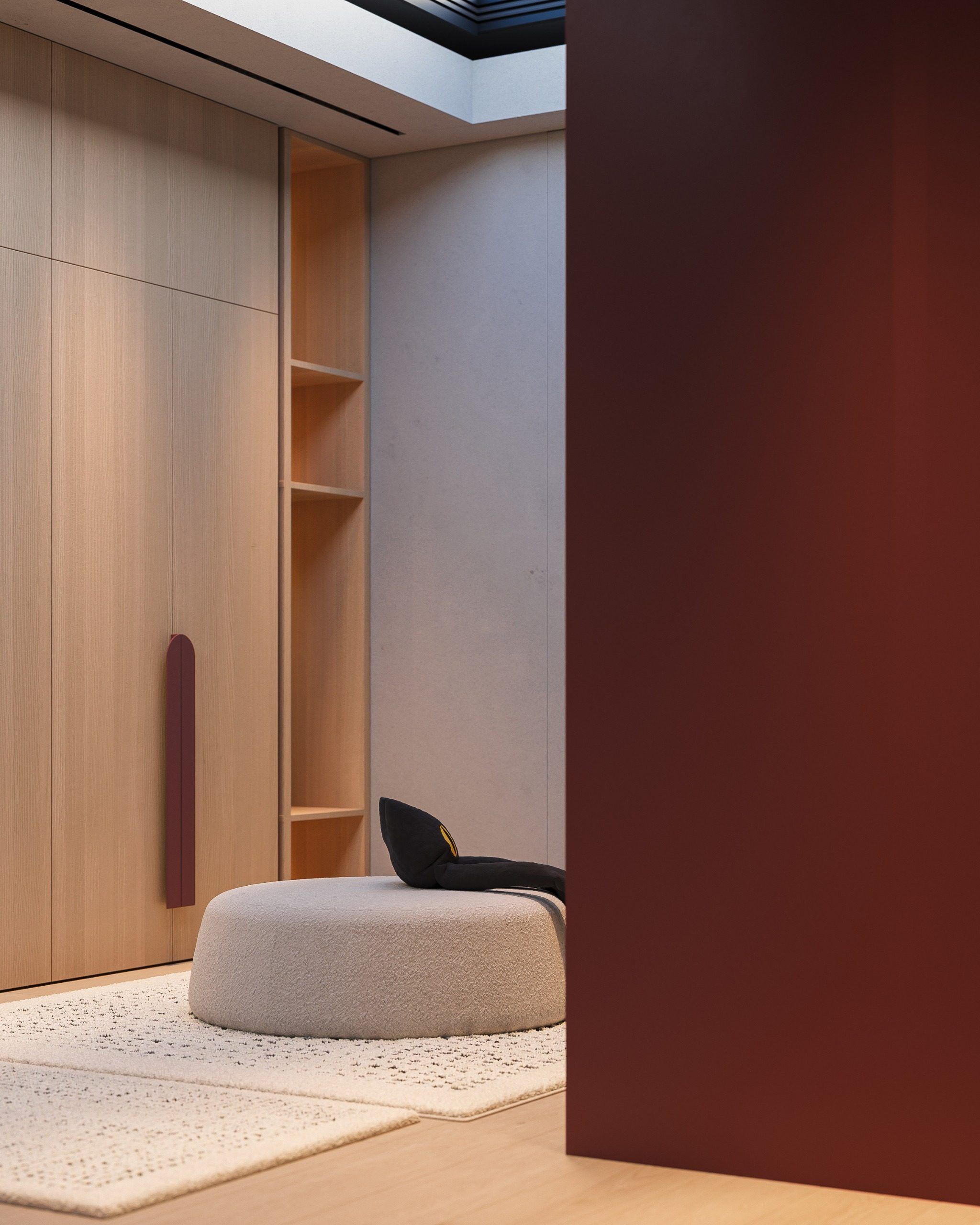 Corner view of closet with wood and burgundy cabinetry with recessed lighting