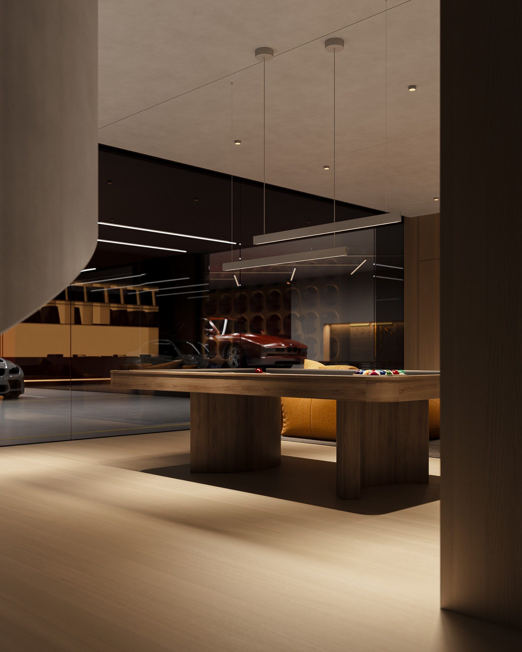 Open-plan kitchen with wooden table and black ventilation hood
