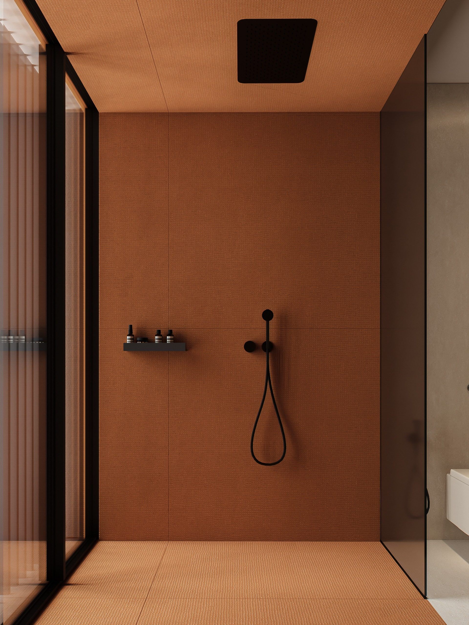 Shower enclosure with terracotta walls, matte black fixtures and minimalist design