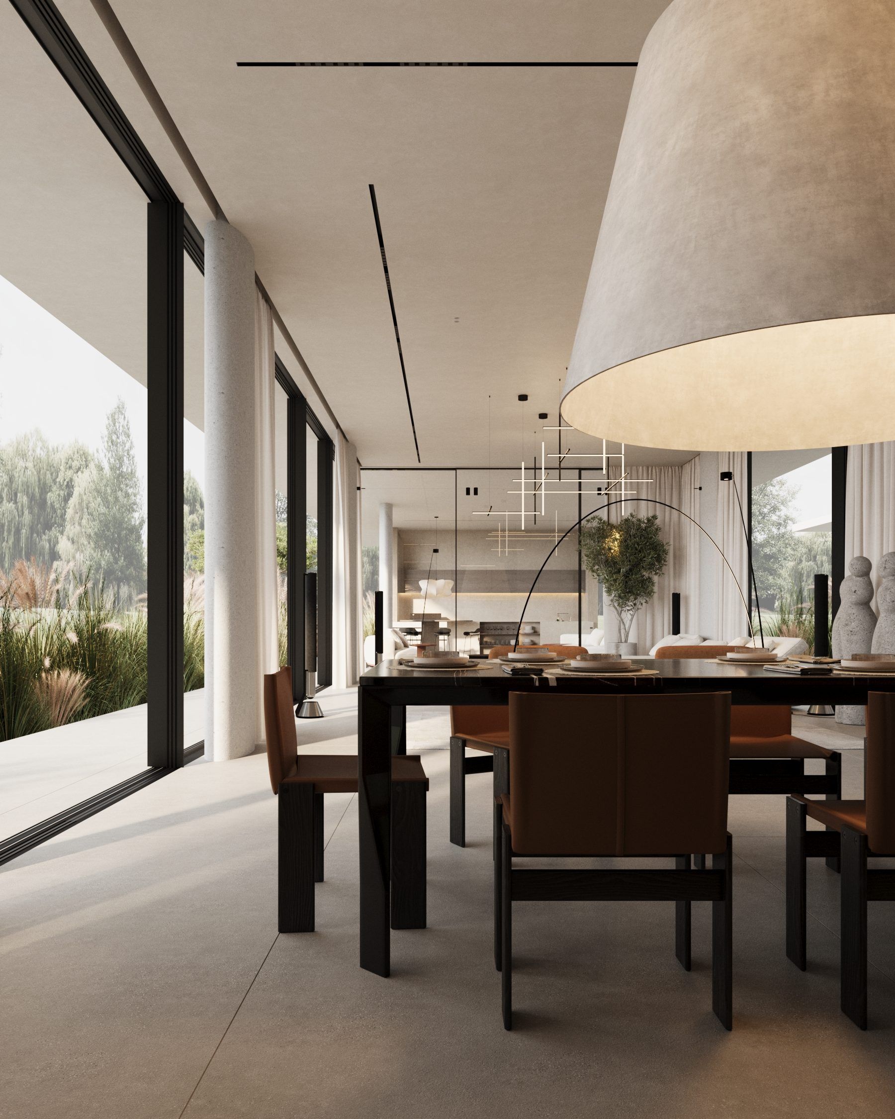 Dining zone with sculptural pendant lamp and terrace garden views