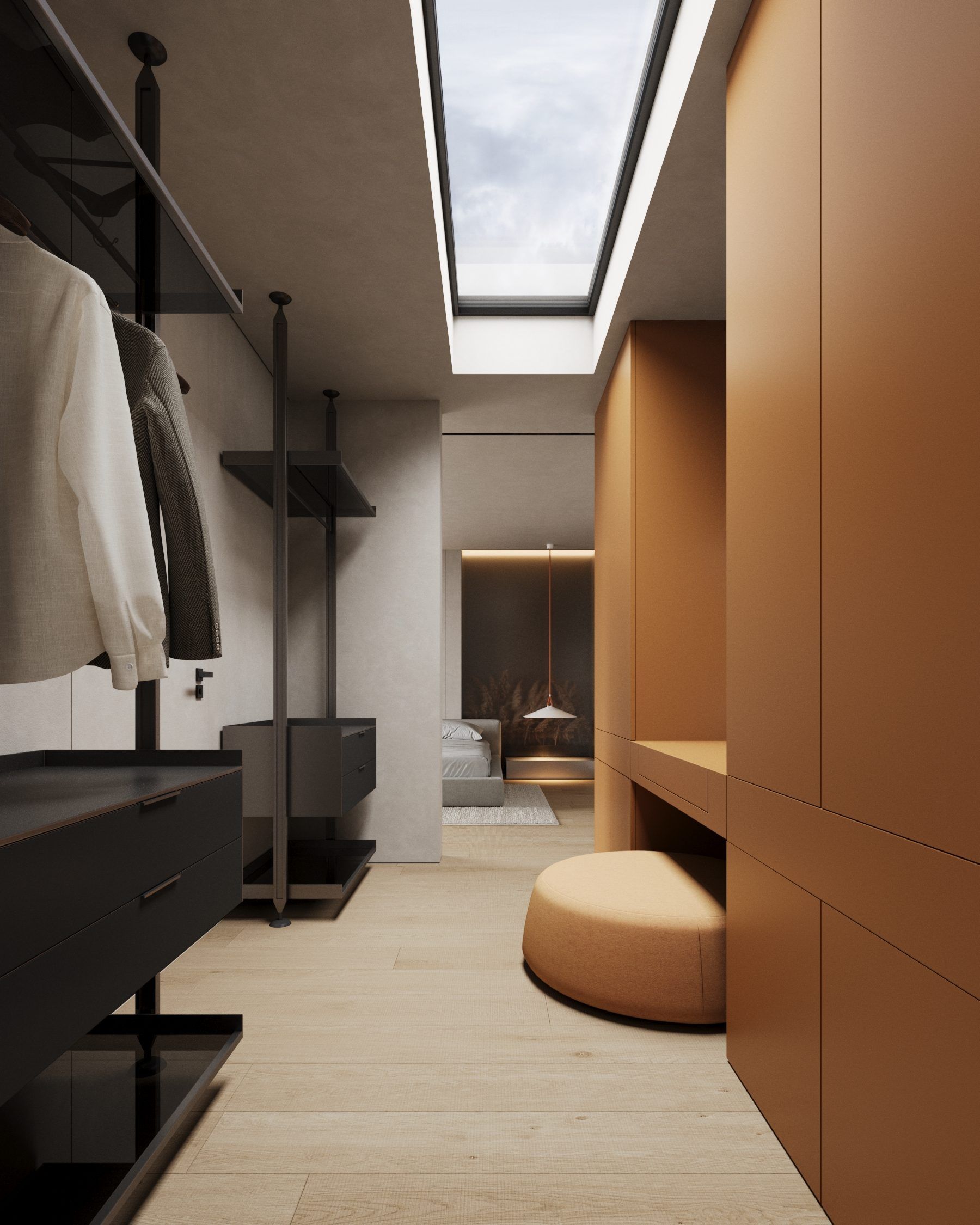 Walk-in closet with oak cabinets, black railing and skylight