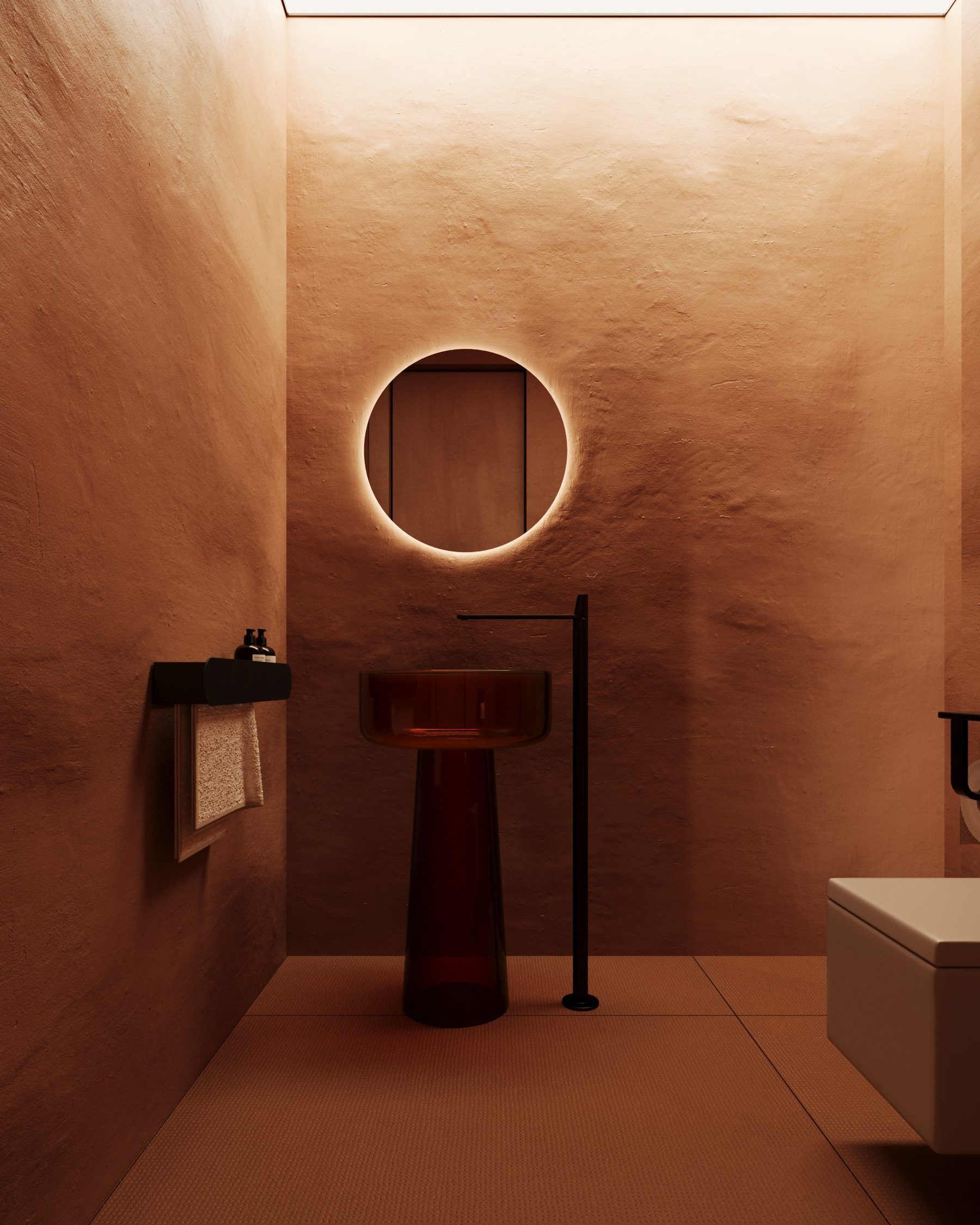 Bathroom with terracotta plaster finish and circular mirror
