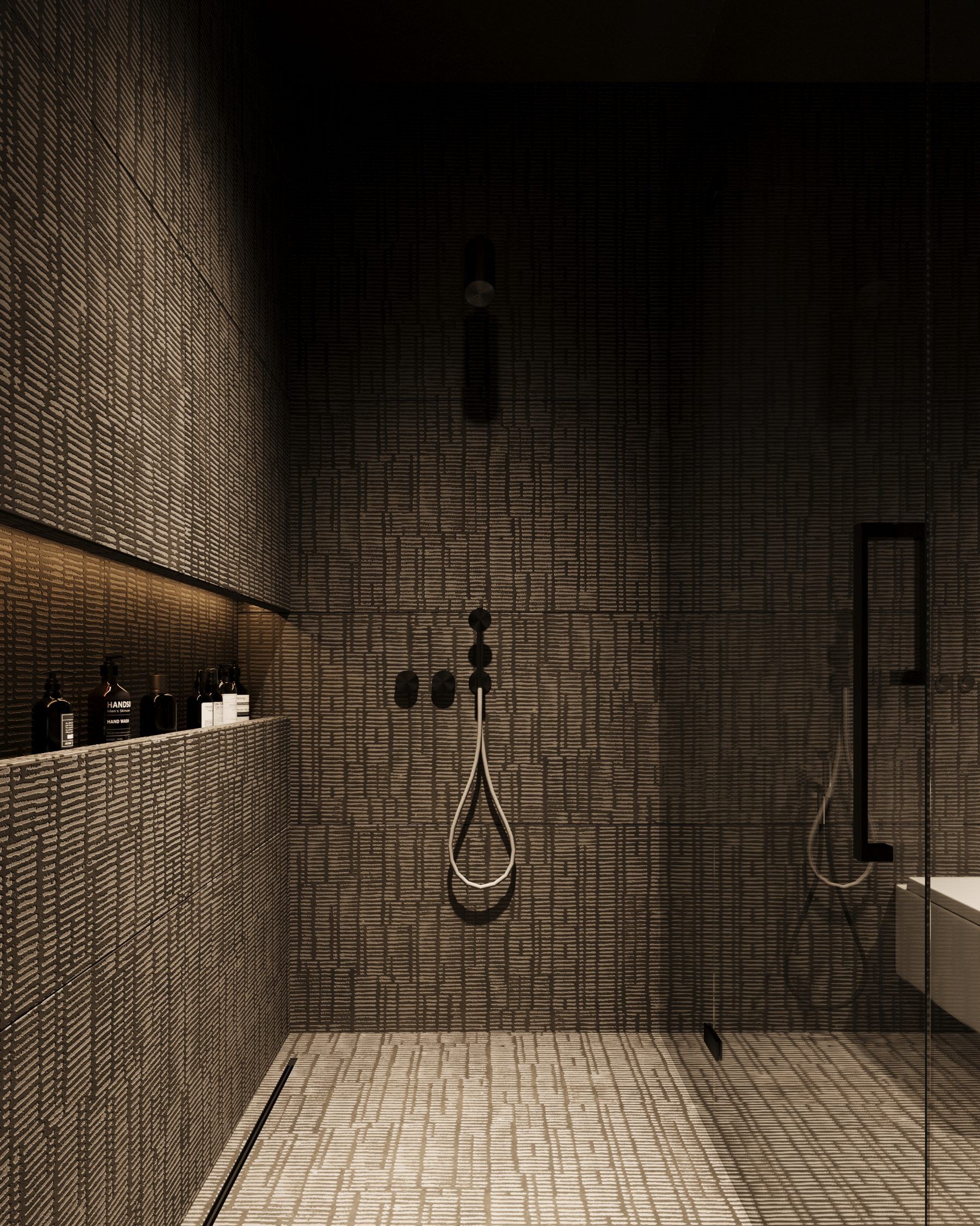 Shower enclosure with brick pattern walls and black fixtures
