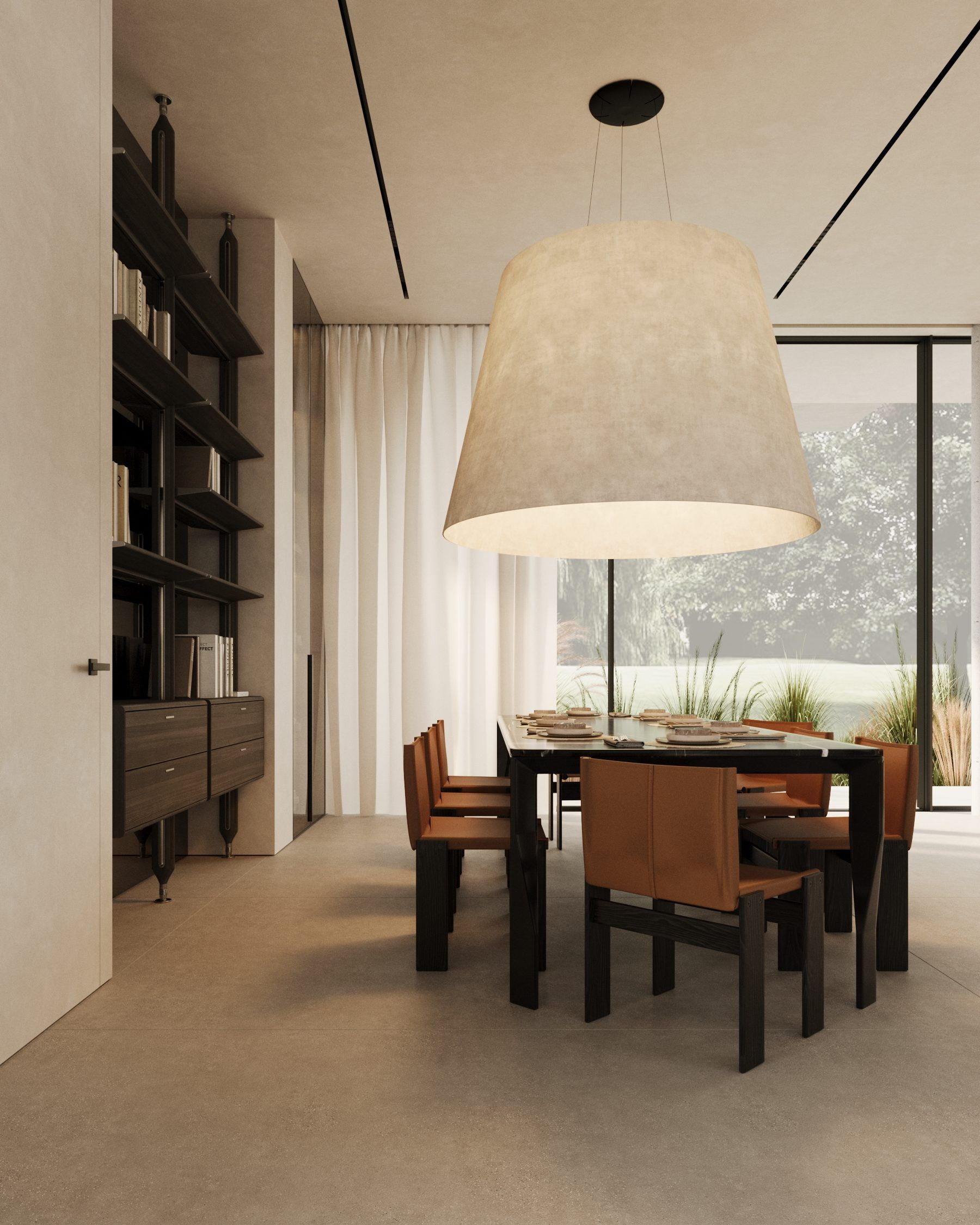 Workspace with bookshelves, desk and chairs beneath sculptural plaster light