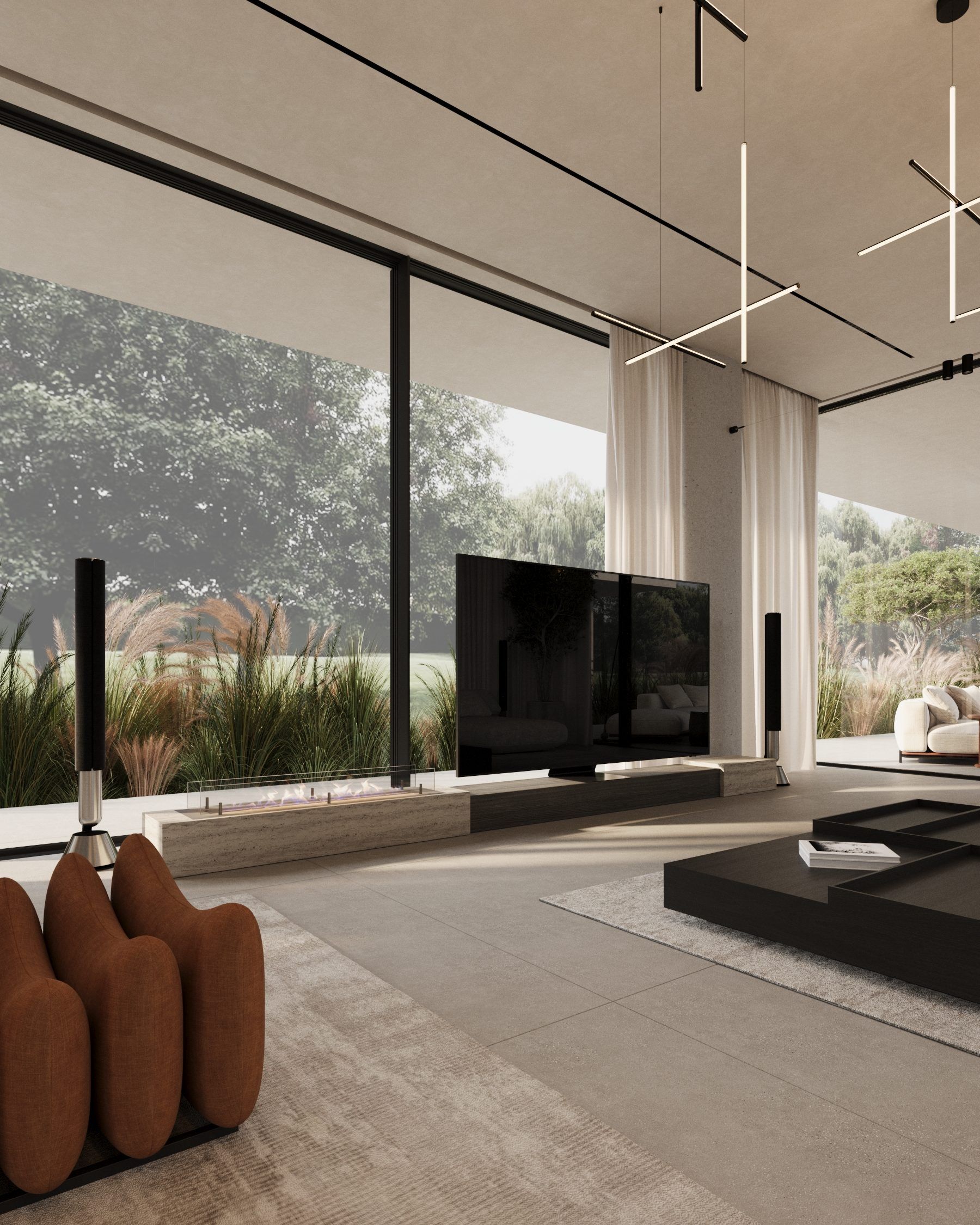 Seating area with brown armchairs, media console and full-height glazing