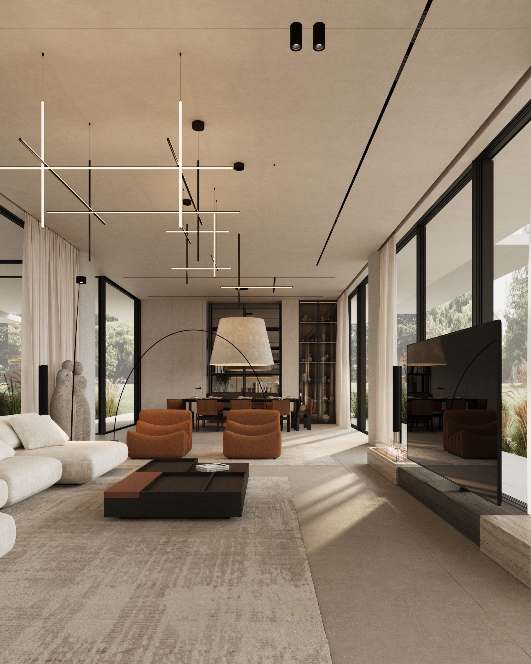 Open-plan interior with brown leather chairs, linen textiles and garden views
