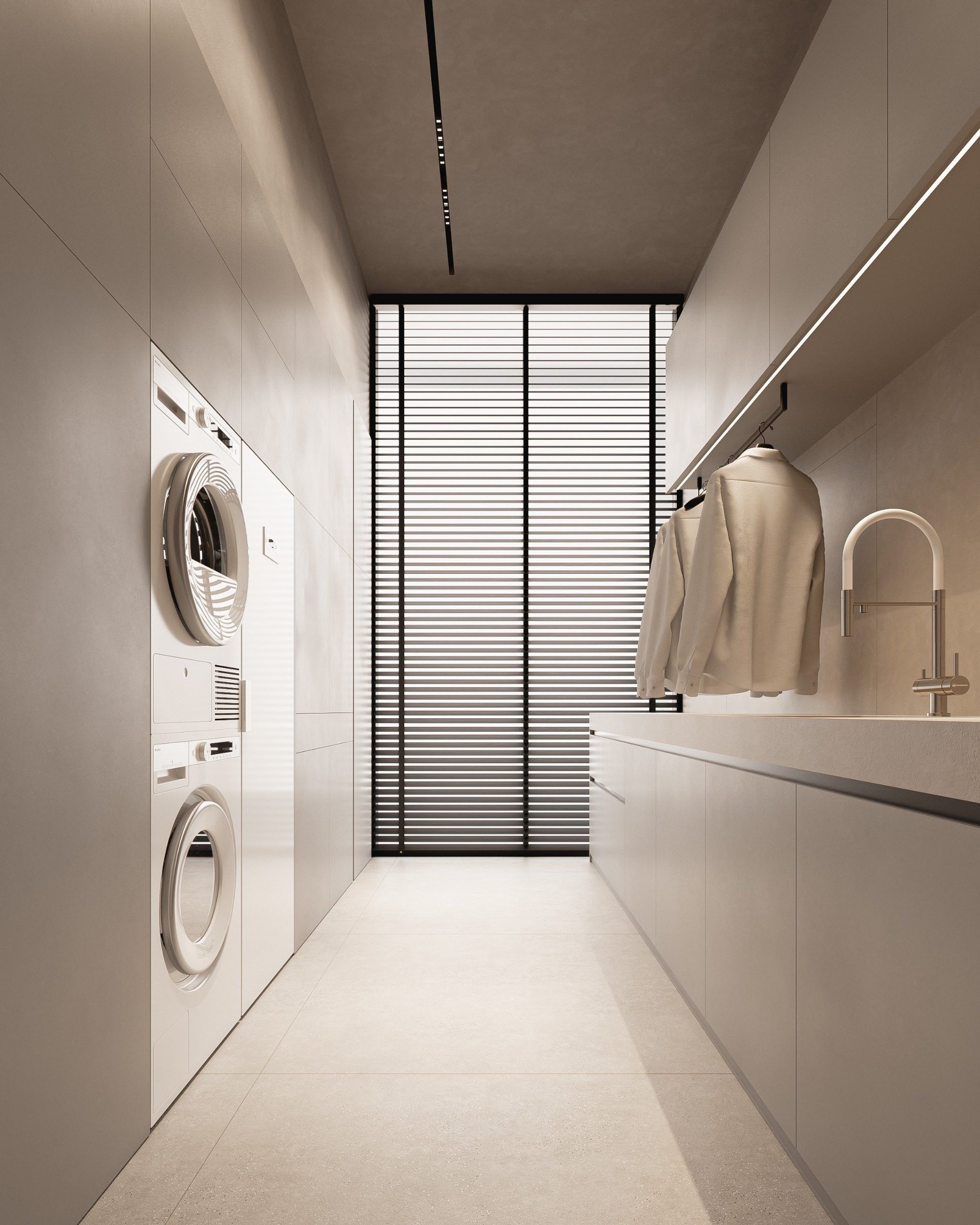 Laundry room with vertical washing machines and minimalist furnishings